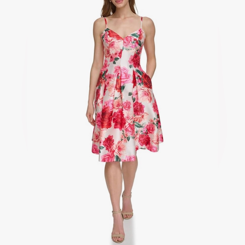 This Eliza J. midi dress features a floral prin. Size 6. New, but without tags.